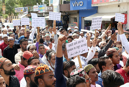 Members of Muslim community stage a protest after offering Friday prayers over the controversial remarks by two now-suspended BJP leaders Naveen Jindal and Nupur Sharma against Prophet Mohammad.