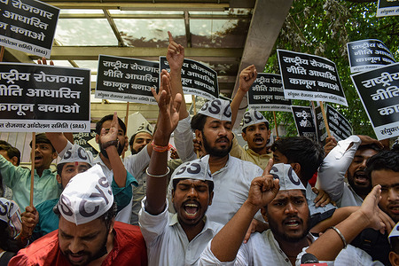 Students and activists shout slogans during a protest outside a metro station in New Delhi against the government's newly introduced scheme known as Agnipath. The Agnipath is a merit-based recruitment scheme for enrolling soldiers, airmen, and sailors. The Scheme provides an opportunity for the youth to serve in the regular cadre of the armed forces for a duration of four years.