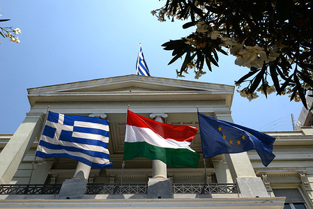 Flags of Greece (left) of Hungary (centre) and of EU (right) in the building of Greek Ministry of Foreign Affairs.