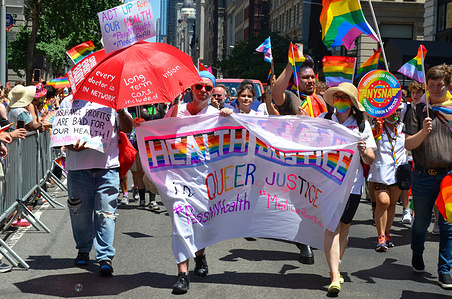 New Yorkers holidng a pride banner at the 53rd Annual Pride Parade through Fifth Avenue in New York City on June 26, 2022.