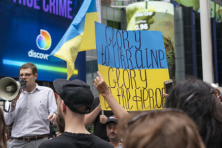 Hundreds of activists, supporters and Ukrainian-Americans staged a rally against Russian invasion into Ukraine at Times Square. Many were holding and wrapping themselves into Ukrainian flags. Rally was attended by Consul General of Ukraine to New York Oleksii Holubov and Latvian Ambassador to the United Nations Janis Karklins.