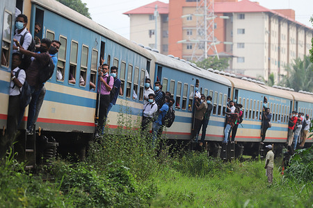 Passengers travel on a crowded train due to the fuel crisis in Sri Lanka, many people come to work using public transport services.
