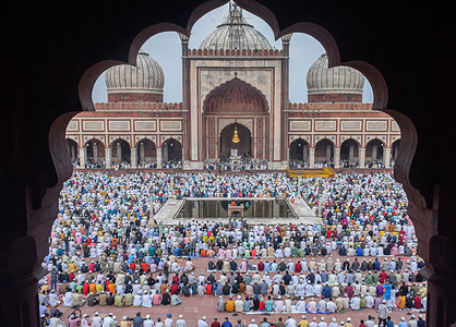 Muslim Devotees offer Prayers at Jama Masjid on the occasion of Eid al-Adha in New Delhi.