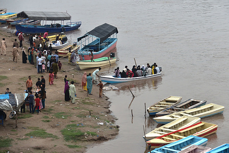 Pakistani people are enjoying boating at the Ravi River during pleasant weather after the monsoon rains in the Provincial Capital city of Lahore.
