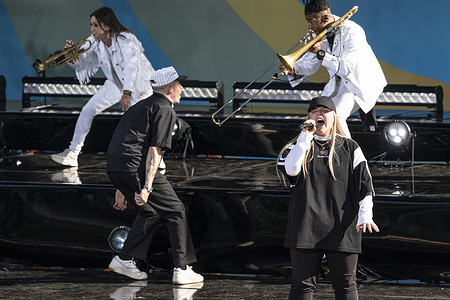 Rapper Macklemore performs with special guest Australian singer Tomes And I (Toni Watson) on Good Morning America concert series in Central Park.