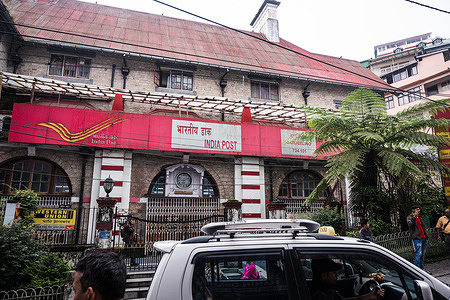 People walk passes the Darjeeling head post office (HPO) on a busy morning in Darjeeling. The UNESCO heritage site Darjeeling head post office heritage building is recorded as one of the oldest post office buildings in the region. This post office building was inaugurated on the 2nd of May, 1921.