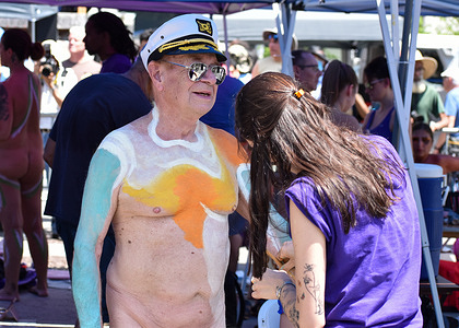 A model painted by an artist in broad daylight to become human works of art during the 9th annual Bodypainting Day at Union Square.