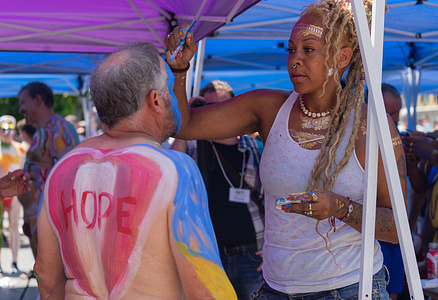 Artists express their art and human connection with body painting as participants strip off their clothes and their bodies become the canvas for creative art.