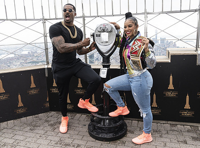 Montez Ford and WWE Raw Women’s Champion Bianca Belair pose on observation deck during visit to Empire State Building