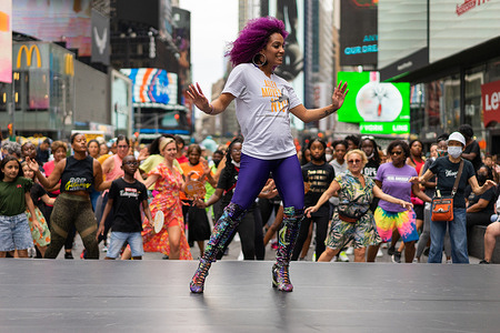Dancer instructor Katherine Jimenez teaches mambo NY style dance in Times Square as part of Ailey Moves NYC free dance classes.