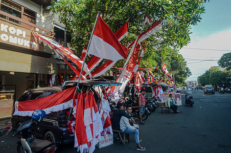 A trader is seen selling Indonesian flags on the side of the road. Residents flocked to buy Indonesian flag in order to welcome the celebration of the Indonesian Independence day on August.