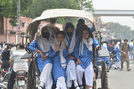 Pakistani students leaving school after classes, school now open after summer vacations in Provincial Capital City, Lahore.