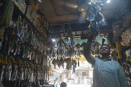 Pakistani vendor displays sacred items used in Azadari for Muharram- ul-Haram processions in a shop in connection with Muharram- ul-Haram, in Provincial Capital city Lahore. Procession is being preparing for mourning rituals during the Holy month of Muharram-ul-Haram which is the first month of the Islamic calendar and second holiest month for Muslims across the world.
