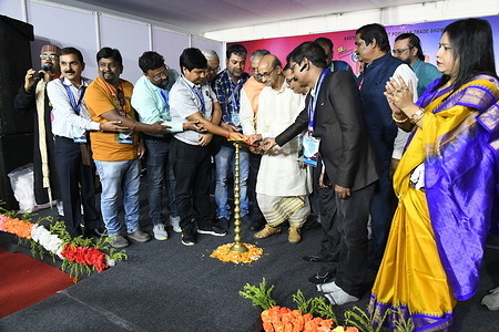 Prof. Biswatosh Sengupta (Middle, Dhoti clad), Eminent Educationist and Artist, inaugurates by lighting dia of the Imagecraft - a photo & videography trade show in the presence of organizing committee members and other distinguished guests. This exhibition starting from today for three days that organized by a private agency.