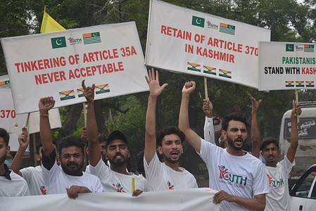 Pakistani activists of Youth Forum for Kashmir (YFFK) shouting slogan during a walk in front of U.S Consulate office on the eve of “Youm-e-Istehsal” in Lahore. “Youm-e-Istehsal” to showing solidarity with Kashmiriri people, as to mark the third year of Indian military siege of Indian illegally occupied jammu and Kashmir and denounce illegal and unconstitutional step to strip its special status.