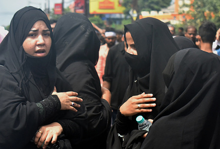 Shi'ite Muslim women take part in a Muharram procession to mark Ashura, in Kolkata.