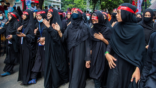 Bangladeshi Shia Muslims march and carry the flags and Tazia during a Muharram procession on the main road in Dhaka. Muharram is respected and observed by Shia Muslims as the month in which Hussein ibn Ali was martyred, the grandson of Muhammad and son of Ali, in the Battle of Karbala.