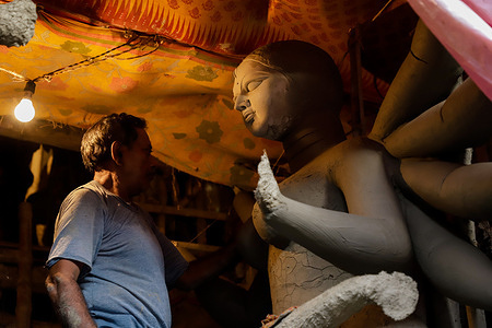 Kumartuli is a traditional potter's quarter in North Kolkata, West Bengal. These highly skilled sculptors preparing clay idols of Goddess Durga ahead of Durga Puja which is to be held in October. The world famous Kumartuli is a 300-year-old potter's settlement.