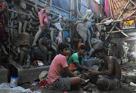 Artists are working inside a workshop ahead of the Durga Puja festival on the outskirts of Kolkata.
