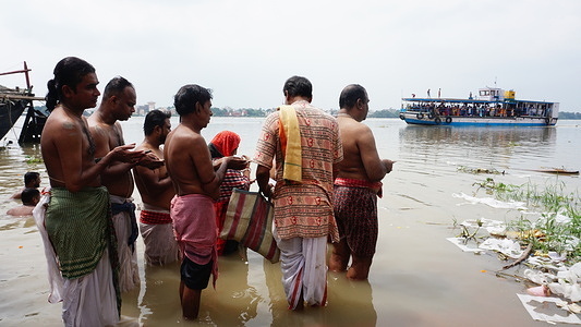 Hindu devotees are performing Tarpan on the very last day of Prityi Paksha in remembrance of their ancestors on the banks of the River Ganga.
