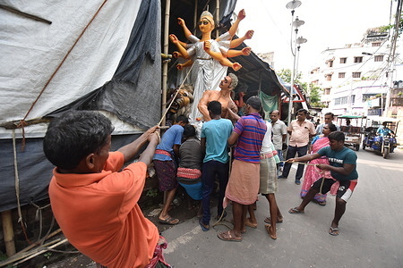 Clay made Durga idol is being transported from a sculptor's studio to community Mandapa ahead of five days duration of Durga Puja that will be performed from 1st to 5th October by the Hindus.