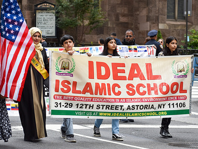 Participants are seen holding a banner of Ideal Islamic School during the annual Muslim Day Parade along Madison Avenue.