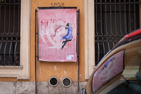 View of Laika's poster entitled "Woman, Life, Freedom", in homage to Iranian women, in the Esquilino district in Rome