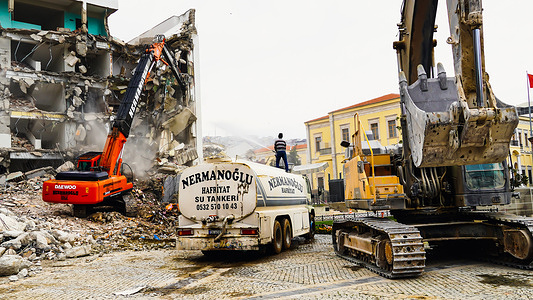 Construction equipment and a worker carry out excavation work of an old building after demolition.Many buildings were damaged with the high-scale earthquakes in the Konak district of Izmir in recent years.