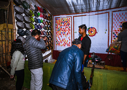 Balloon shooting With Gun booth in a fair on the occasion of Christmas of Tehatta, West Bengal; India on 25/12/2022