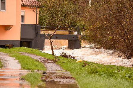 Beranga, SPAIN: The Rio Campiazo as it passes through Beranga in which the rio baja churned during the storms Fien and Gerard cross Spain in Beranga, Spain on January 17, 2023.