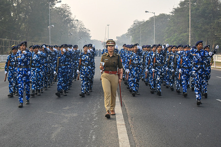 Kolkata police rapid action women force takes part in the rehearsal for the Republic Day parade on a cold winter morning in Kolkata.