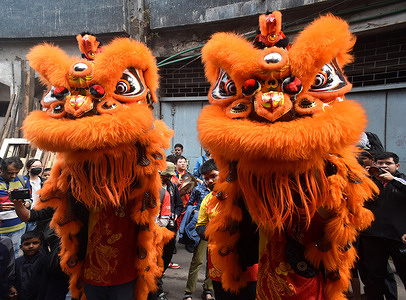 Members of the Chinese community perform a dance as they take part in celebrations to mark the Chinese Lunar New Year in Kolkata.