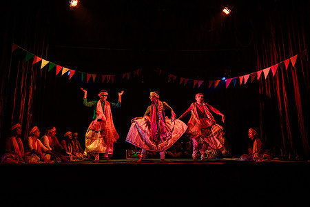 Romeo and Juliet is a tragedy written by William Shakespeare early in his career about the romance between two Italian youths from feuding families. It was among Shakespeare's most popular plays during his lifetime and, along with Hamlet, is one of his most frequently performed plays. Surprisingly Romeo and Juliet were performed in a remote village in West Bengal in the Bengali language in imitation of the ancient Bengali Culture in a bit of a colorful way some male actors act as females and named 'Bhanu Sundiri Pala' organized by Tehatta Angikar Goshthi Club. This photo was taken at Tehatta, West Bengal; India on 20/01/2023.