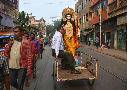 A person taking home idols of Goddess Saraswati, ahead of Saraswati puja or Vasant Panchami celebration.