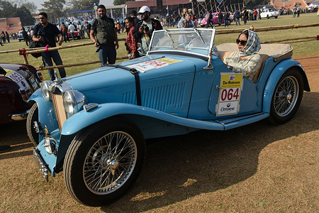 An MG midget car participates in the vintage car rally in Kolkata.
