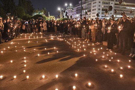 Crowds have gathered in central Athens today in a silent protest over the deadly train collision in Tempi. People of all ages with candles, black balloons and banners that said: "Take me when you arrive" were gathered outside the Greek Parliament.