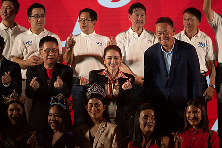 Paethongtarn Shinawatra (C), Chairman of the Engagement and Innovation Advisory Board of The Pheu Thai Party, and Srettha Thavisin (R), Chief Advisor to the Head of the Pheu Thai Family, Help Pheu Thai Party's candidate for the House of Representatives, during a campaign at Stadium one, Banthadthong Road, Pathum Wan district, Bangkok, Thailand, on March 24, 2023.