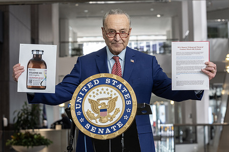 U. S. Senator Charles Schumer speaks while holding photos of bottle with drug Xylazine and letter issued by Drug Enforcement Administration (DEA) alerting of threat as fentanyl is mixed with Xylazine during briefing on drug Xylazine linked to overdose deaths at 875 3rd Avenue lobby in Manhattan