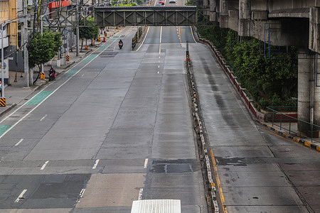 The Epifanio de los Santos Avenue (EDSA) in Quezon City, Philippines is almost empty of vehicles on Good Friday.