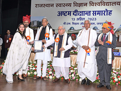 Rajasthan Chief Minister Ashok Gehlot and Governor Kalraj Mishra present a degree to a student during 8th Convocation of Rajasthan University for Health Sciences (RUHS) at Birla Auditorium in Jaipur. Health Minister Parsadi Lal Meena and Vice Chancellor Dr Sudhir Bhandari is also seen.