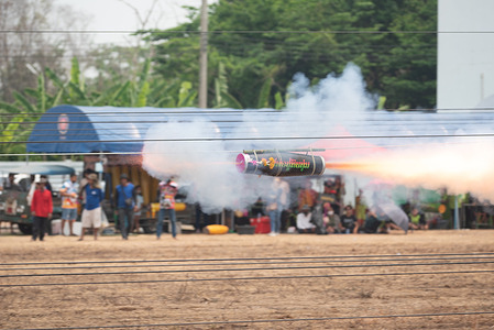 The rocket competition during a traditional ethnic "Mon rocket festival" (Look Noo festival). In the past, it was an ancient tradition of the Mon people, people in the community are now organizing local competitions at Dipangkornwittayapat (Mattayomwathatasankaset) School, Amphoe Khlong Luang, Pathum Thani province (45 kilometers north of Bangkok).