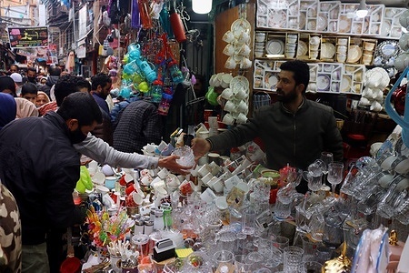 People shop at a crockery store ahead of Eid Al-Fitr which marks the end of the holy month of Ramadan in Srinagar,Kashmir on April 21, 2023.