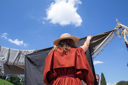 A girl dressed as a Roman handmaiden inside the Circus Maximus in Rome, on the occasion of the 2776th anniversary of the foundation of Rome