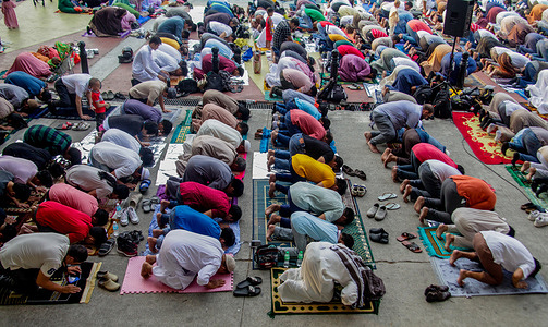 In Manila Philippines, the Muslim community celebrates Eid al-Adha to pray while waiting for the sunrise and to end a month of fasting