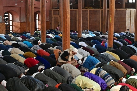 People attend prayers on the first day of Eid-Al-Fitr in Srinagar, Kashmir on April 22, 2023. Authorities in the region disallowed Friday congregational prayers at the Grand Mosque in old Srinagar, the Summer captial of Indian Administrated Kashmir.