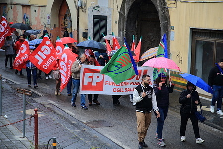 On the day of Workers' Day, the First of May, procession of the various trade union CGIL, CISL, UIL, and specific compartments with their representatives of workers. A march through the streets of the city of Nocera Inferiore, to claim the rights of all workers and to remember the seventy-five years of the Italian Constitution (1948 ) that reads as follows: "Italy is a democratic republic founded on work ".