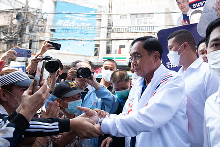 Prayuth Chan-ocha (R), Prime Minister Candidate of United Thai Nation Party, campaign campaign to meet people at Phra Pradaeng Market, Samutprakan Province (north adjacent to Bangkok), Thailand, on May 5, 2023.