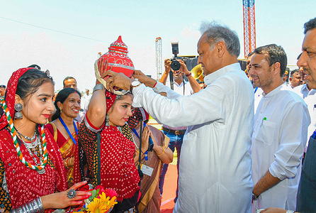 Rajasthan Chief Minister Ashok Gehlot being welcomed by girls during inaugration ceremony of Haldighati Youth Festival at Nathdwara in Rajsamand district.