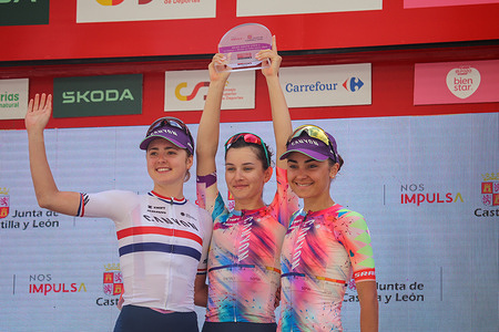 Laredo, Spain, 06th May, 2023: Cyclists from Canyon / / SRAM Racing, Alice Towers (L), Elise Chabbey and Ricarda Bauernfeind (R) collect the award for the best team of the stage during the 6th stage of the women's LaVuelta by Carrefour 2023 between Castro-Urdiales and Laredo, on May 6, 2023, in Laredo, Spain.