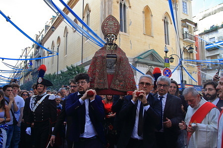 Naples , Italy - May 06, 2023:Seen the ampoule containing the blood of the Saint and the bust of San Gennaro in procession through the streets of the historic center. According to tradition the Saturday before the first Sunday of May is what is called the "miracle of May" of San Gennaro, with the solemn procession of the bust of the patron saint of Naples and the precious ampoules containing the blood of the Martyr from the Cathedral to the Basilica of Santa Chiara.